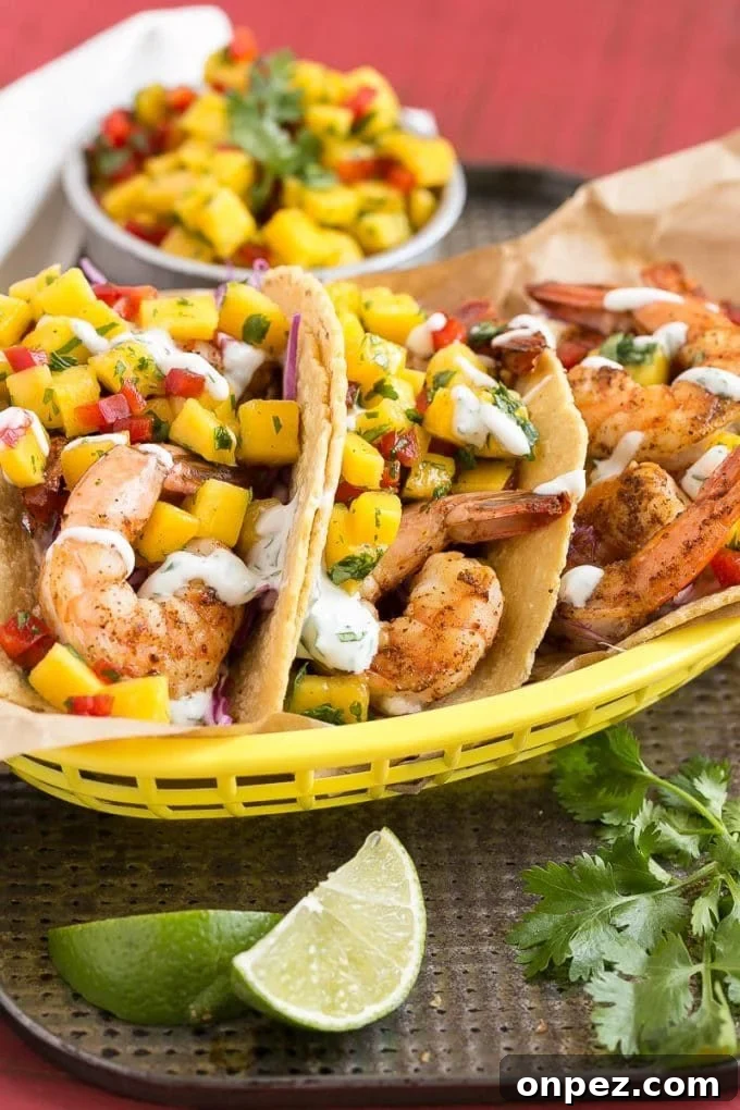 Corn tortillas filled with shrimp, creamy lime sauce and mango salsa.