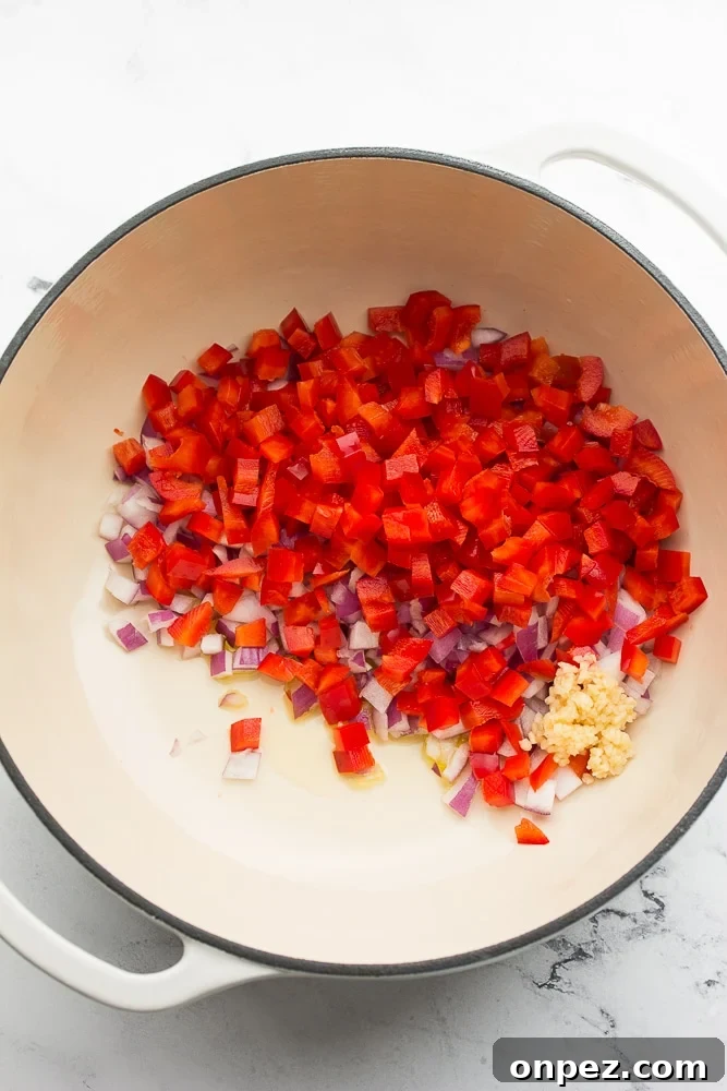 Vegan Burritos with Black Beans and Rice 3 white pot with onion, red pepper and garlic