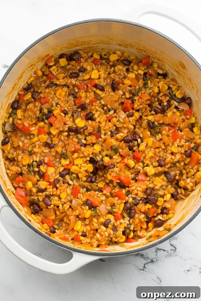 Vegan Burritos with Black Beans and Rice 5 white pot with vegetarian burrito mixture in it, cooked
