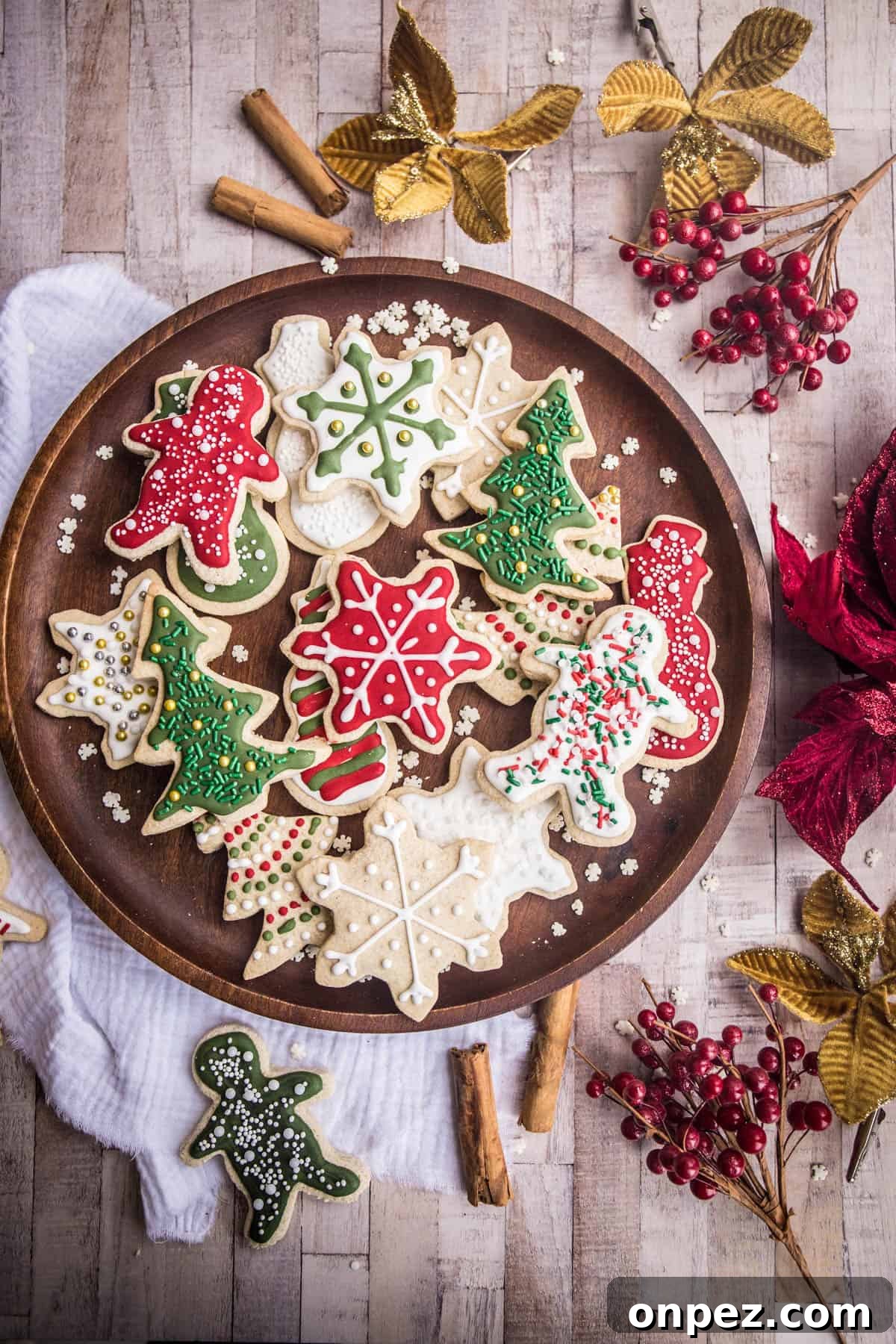 Gluten-Free Christmas Cookies for the Holidays 15 Wooden plate full of Christmas Cookies with Christmas Decorations surrounding