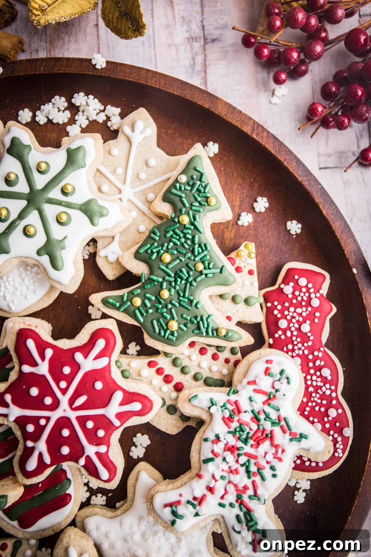Gluten-Free Christmas Cookies for the Holidays 16 Wooden plate full of Christmas Cookies with Christmas Decorations surrounding