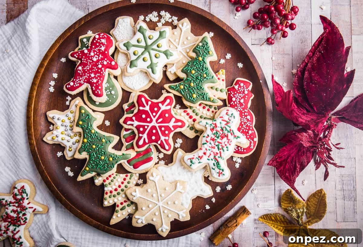 Gluten-Free Christmas Cookies for the Holidays 17 Wooden plate full of Christmas Cookies with Christmas Decorations surrounding
