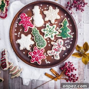 Gluten-Free Christmas Cookies for the Holidays 19 Wooden plate full of Christmas Cookies with Christmas Decorations surrounding