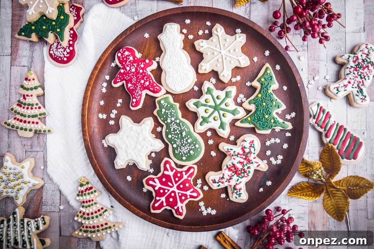 Gluten-Free Christmas Cookies for the Holidays 3 Wooden plate full of Christmas Cookies with Christmas Decorations surrounding