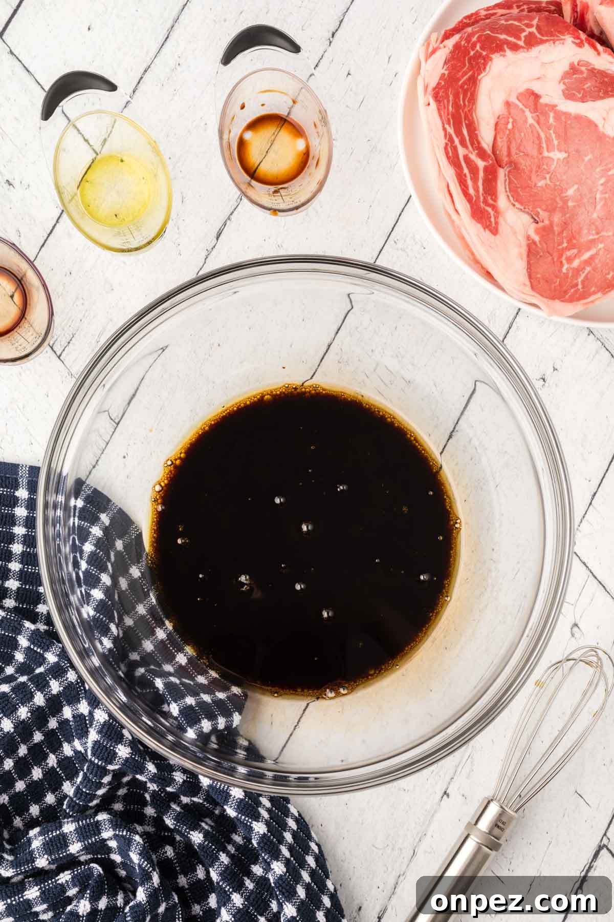 3-Ingredient Steak Marinade for Juicy, Tender Steaks 4 Marinade mixture in a glass bowl.