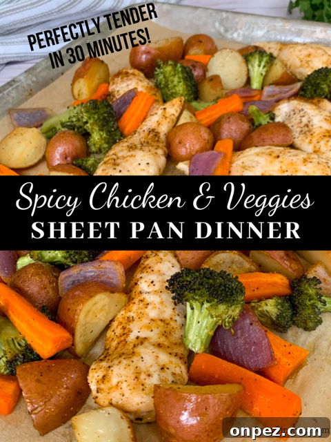 Spicy Sheet Pan Chicken Dinner with Vegetables 2 Spicy chicken sheet pan dinner with roasted vegetables, potatoes, carrots, broccoli, onion, and seasoned chicken tenderloins