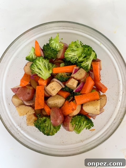 Spicy Sheet Pan Chicken Dinner with Vegetables 4 Seasoned vegetables in a bowl for spicy chicken sheet pan dinner