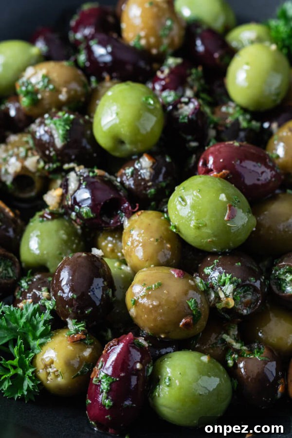 Garlic and Herb Marinated Olives Recipe 2 Green, black and Kalamata marinated olives with garlic and fresh herbs