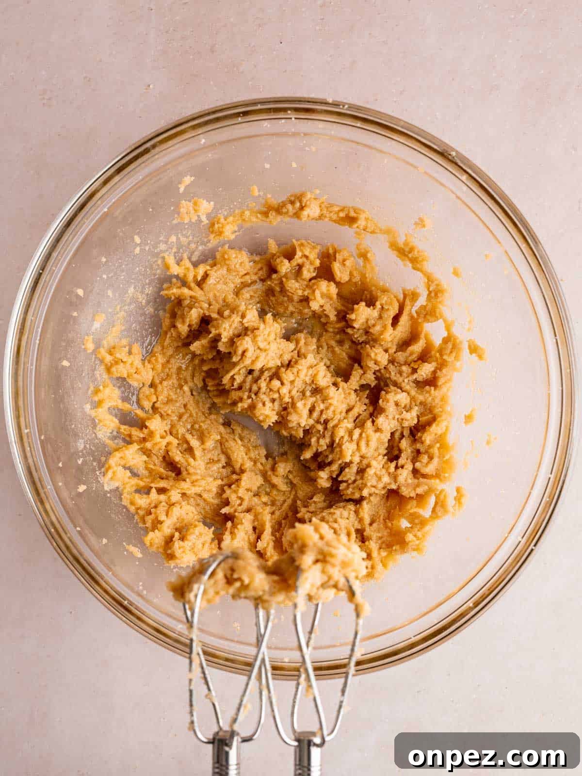 Levain Bakery Copycat Caramel Coconut Chocolate Chip Cookies 5 Butter, sugars, egg, and vanilla extract creamed together in a bowl.