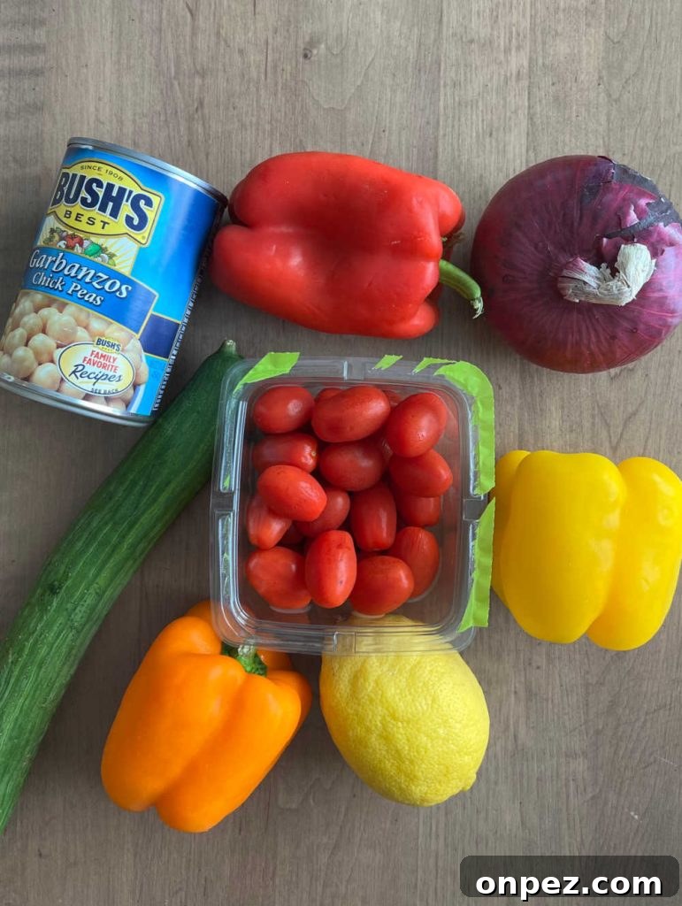 Mediterranean Chickpea Salad Recipe with Lemon and Herbs 3 garbanzos chickpeas, bell pepper, red onion, grape tomatoes, lemon and cucumber