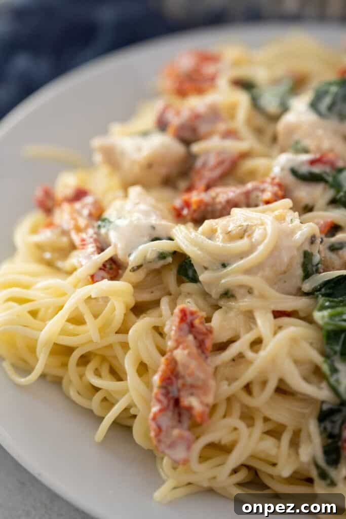 Skillet Creamy Tuscan Chicken Pasta 3 creamy Tuscan chicken pasta on white plate
