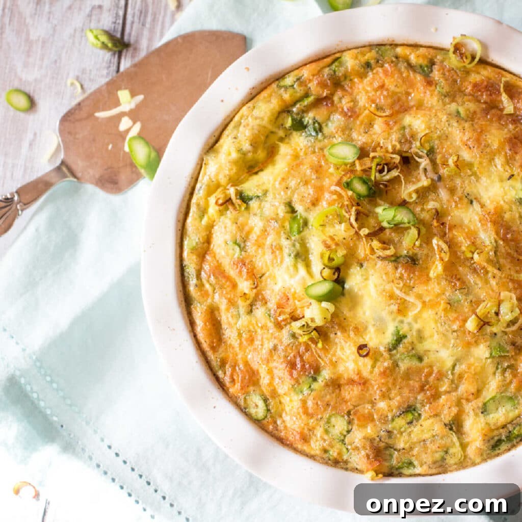 Keto Cream of Asparagus Soup: Low-Carb, Creamy Recipe 4 Asparagus quiche in a pie plate, topped with a few crispy leeks.