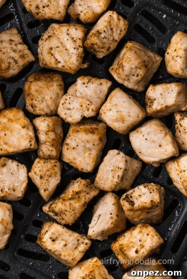 Close up of pork chop bites in the air fryer.