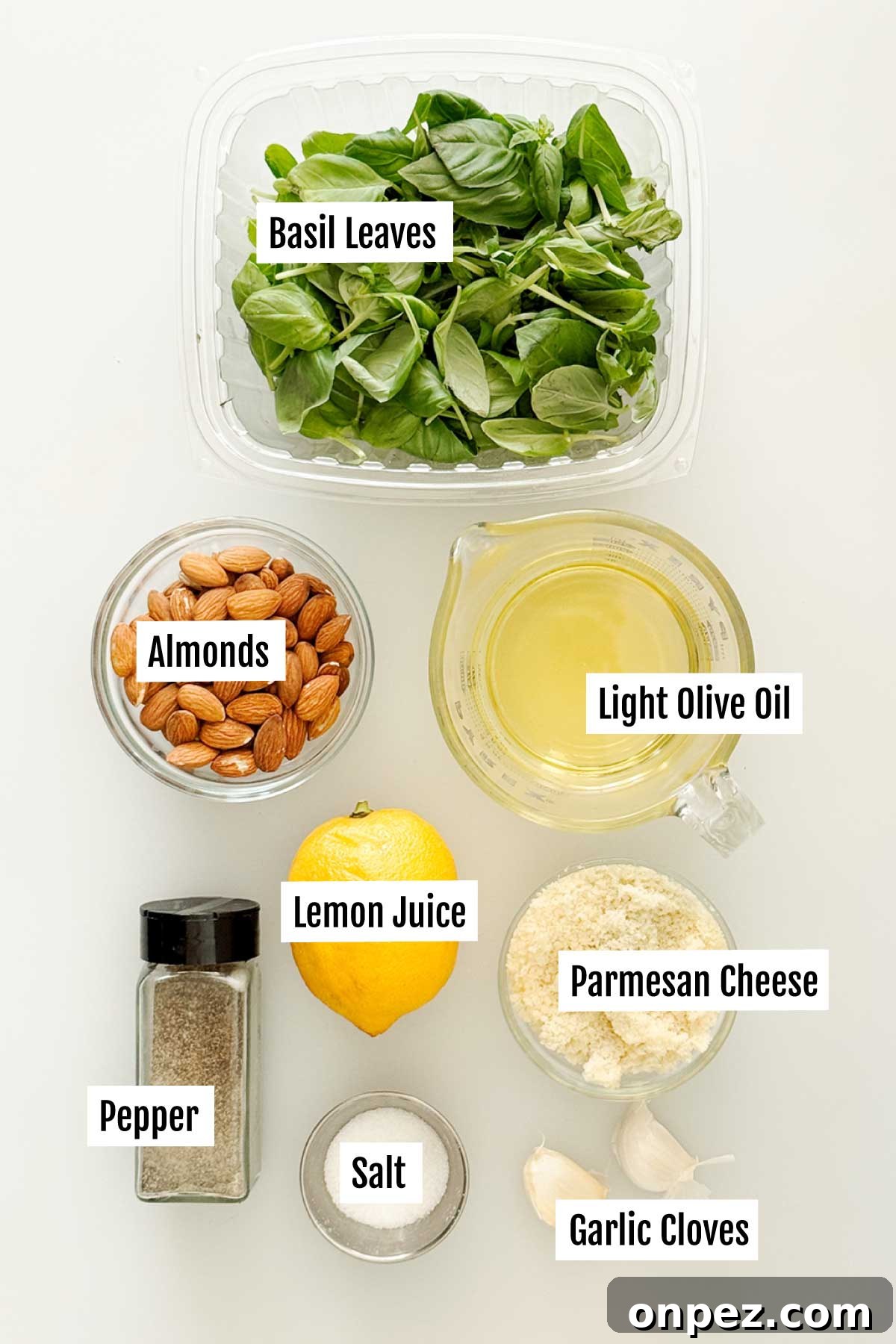 All the ingredients needed to make pesto sauce without pine nuts with almonds.
