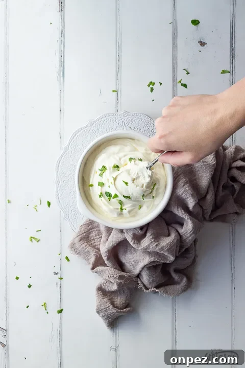 How to Substitute Creme Fraiche in the UK 7 Someone spooning a bowl of crème fraîche