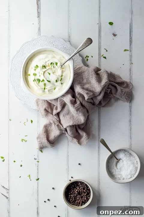 How to Substitute Creme Fraiche in the UK 8 A bowl of creme fraiche on a plate with salt and pepper