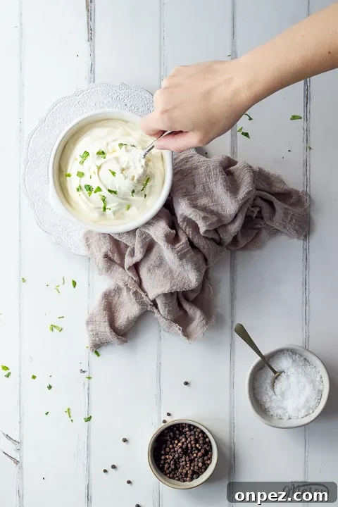 How to Substitute Creme Fraiche in the UK 3 Someone stirring creme fraiche in a bowl