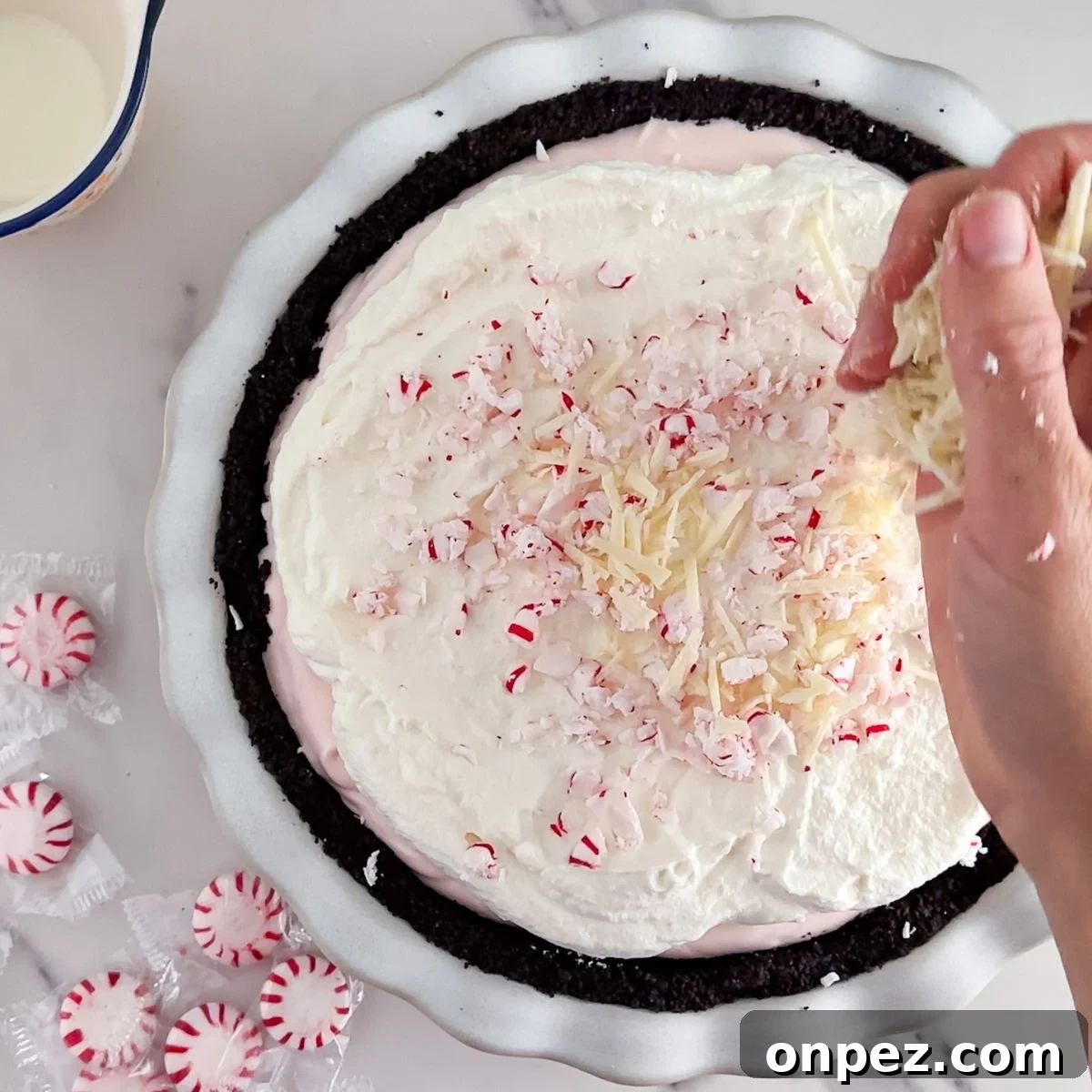 Creamy Peppermint Pie with Chocolate Crust 7 Top with peppermint and white chocolate.