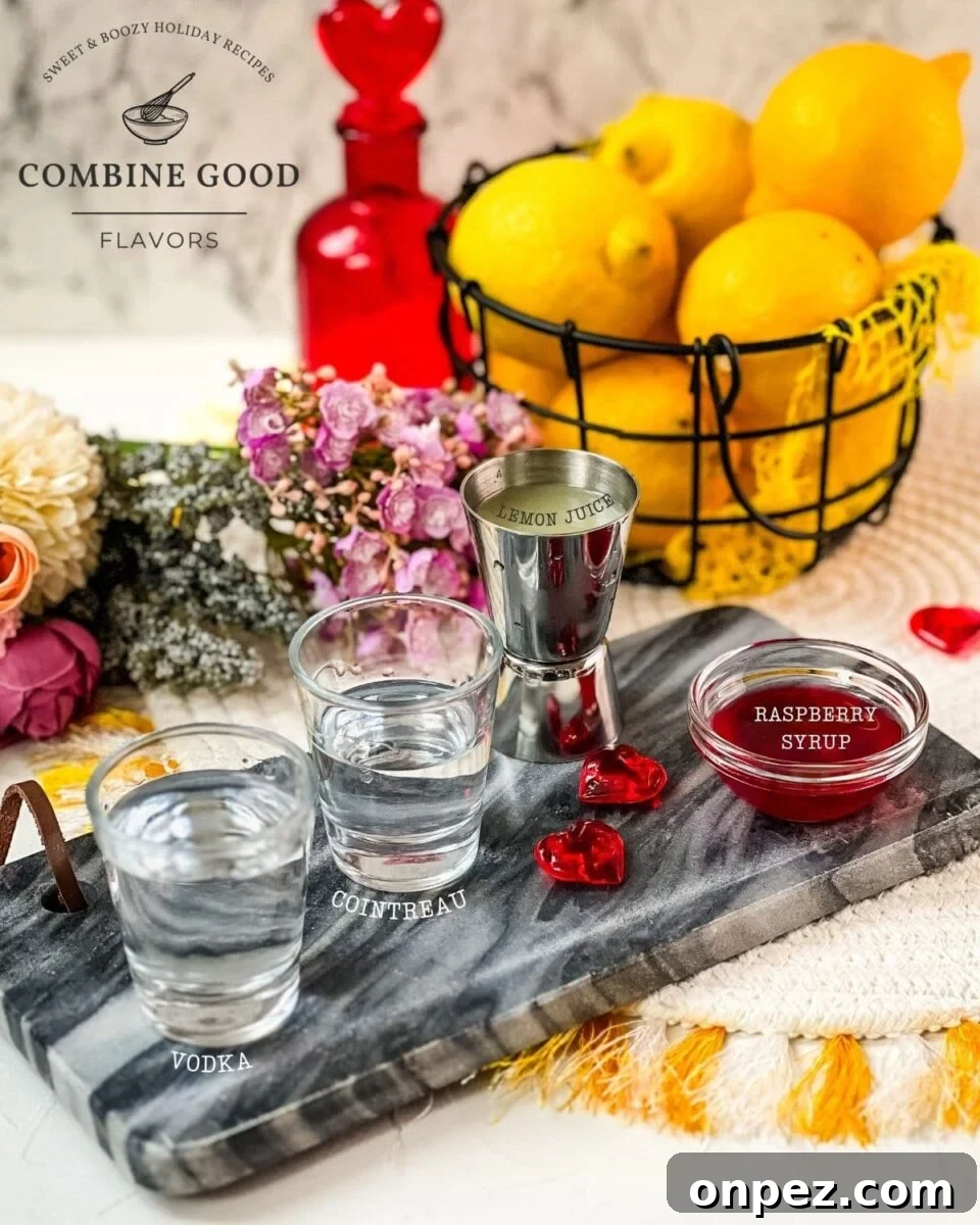 Ingredients for making a raspberry lemon drop martini - vodka, cointreau or triple sec, lemon juice and raspberry syrup.