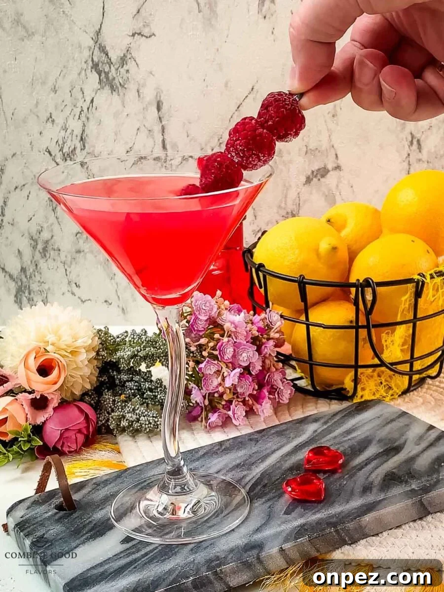 Carefully add the raspberry spike into the raspberry lemon drop martini.