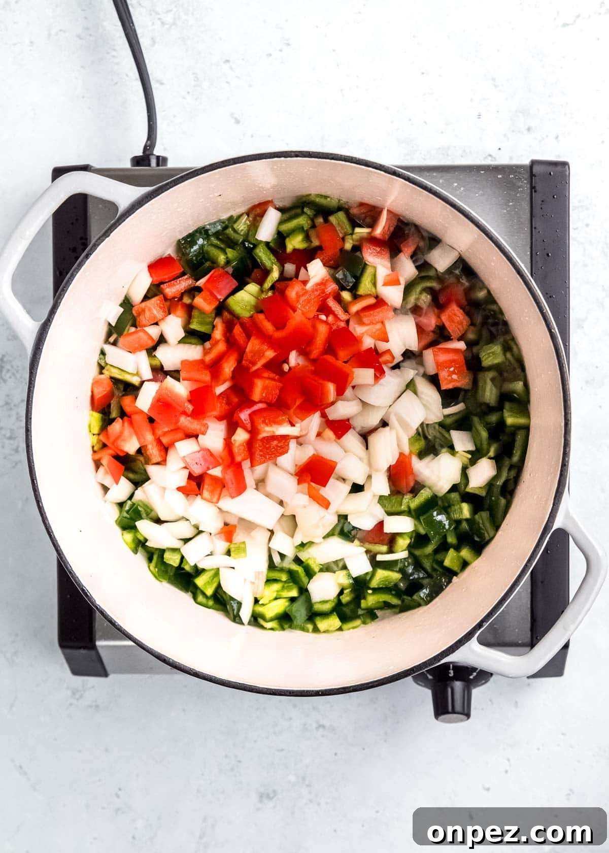 vegetables being sauteed in dutch oven