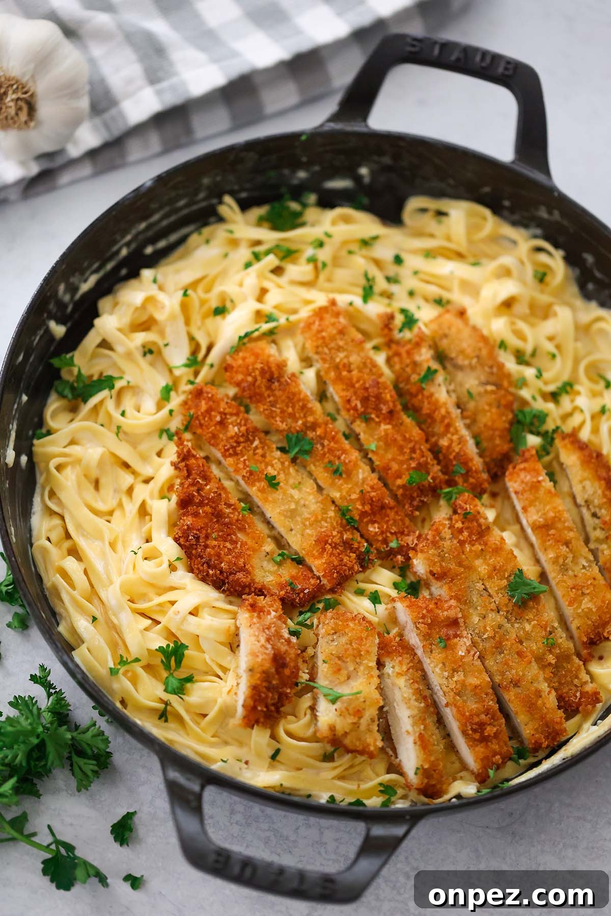 Crispy chicken sliced into bite sized pieces served over Fettuccine Alfredo.