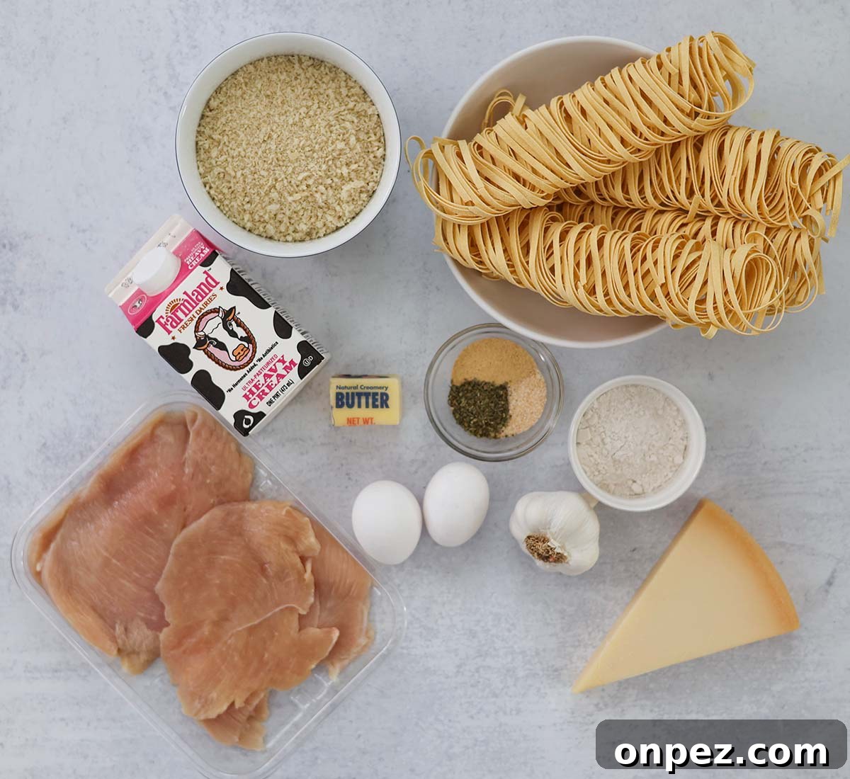 bread crumbs, fettuccine, heavy cream, raw chicken, eggs, spices, parmesan cheese, garlic, butter, and flour.