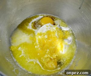 Mixing cream cheese filling for lemon blueberry cake recipe