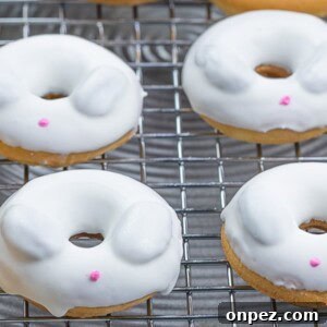 mini Easter bunny donuts with candy melt on a cooling rack