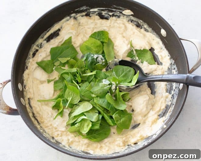 Creamy Chicken and Spinach Enchiladas 3 Spinach added to creamy enchilada filling