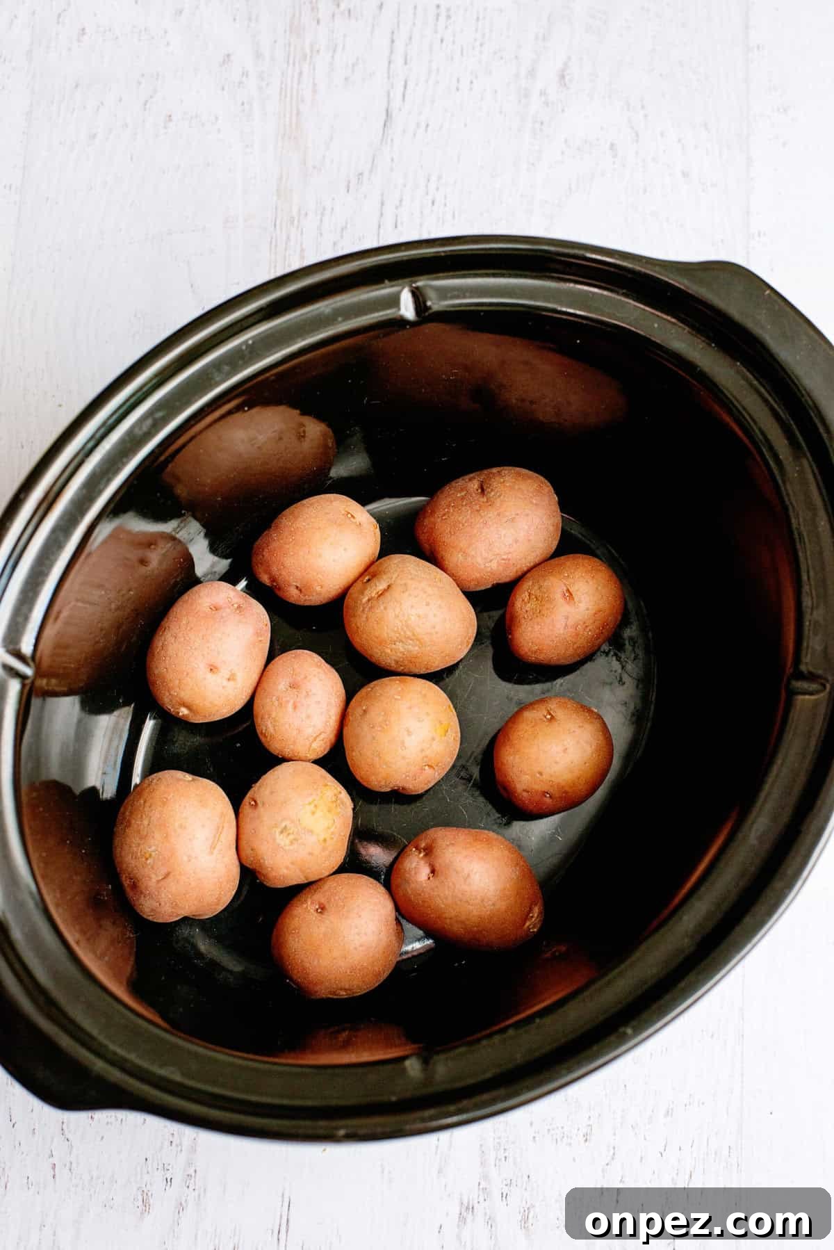 Slow Cooker One-Pot Chicken Dinner Recipe 5 add potatoes to the crock pot