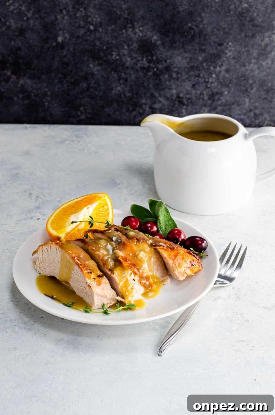 sliced turkey breast with gravy on a plate