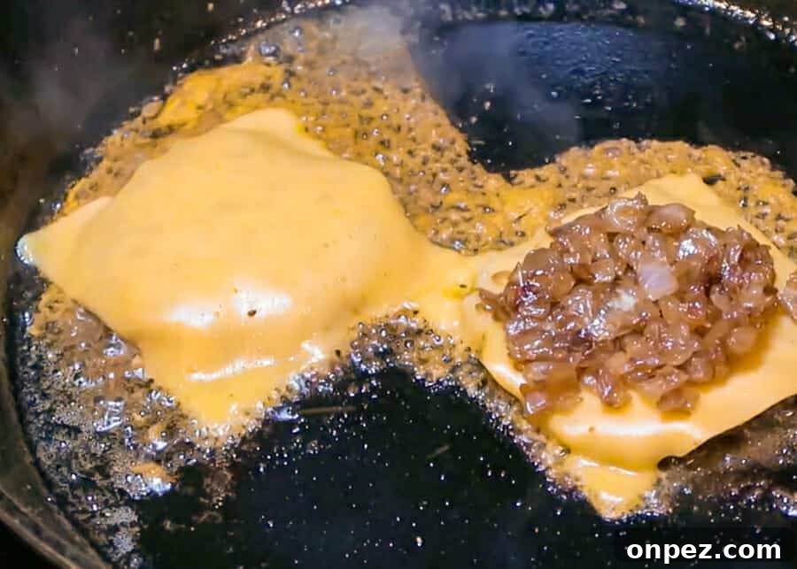 In-N-Out Double-Double Animal Style Copycat Recipe 19 Adding caramelized onions to a burger patty
