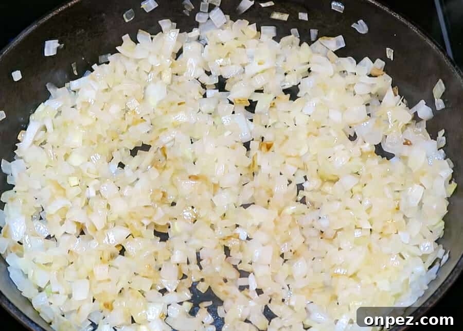 In-N-Out Double-Double Animal Style Copycat Recipe 6 Onions starting to cook in a pan