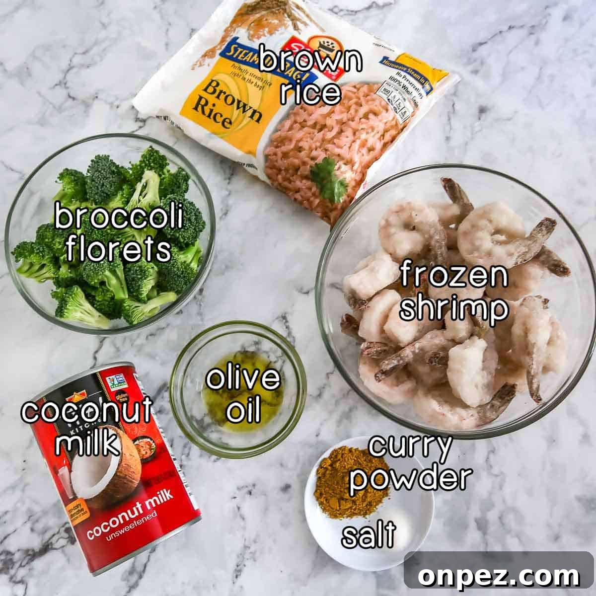 Shrimp and Broccoli Curry over Fragrant Jasmine Rice 3 Overhead shot of ingredients- brown rice, broccoli florets, frozen shrimp, coconut milk, olive oil, curry powder, and salt.