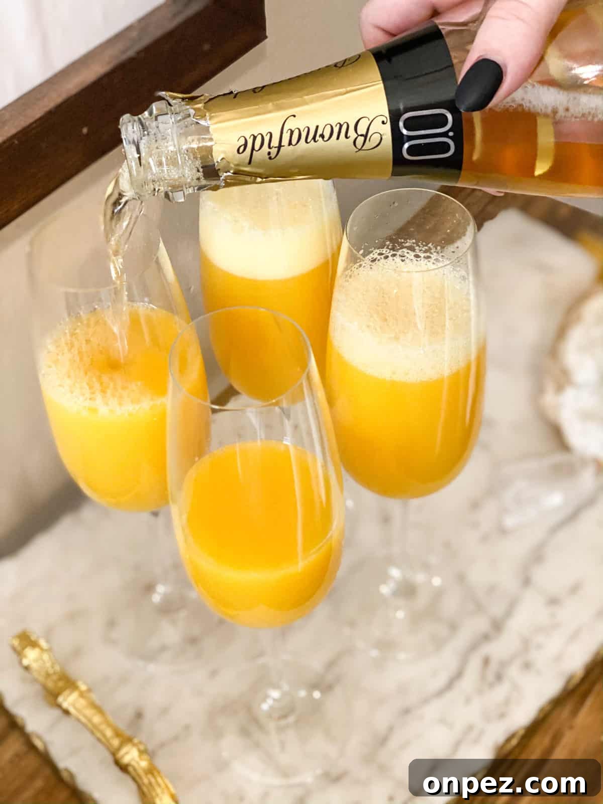 Mimosa Mocktail (Non-Alcoholic) being poured