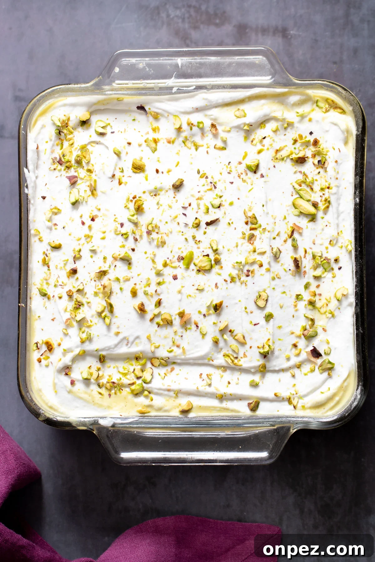 vegan ras malai tres leches in a pyrex loaf pan