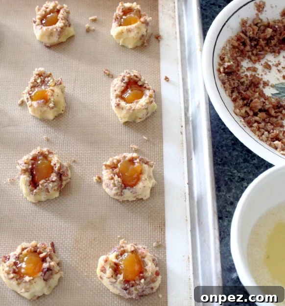 Peach Pecan Thumbprint Cookies with Brown Butter Glaze 4 Peach Pecan Thumbprint Cookies filled with peach preserves