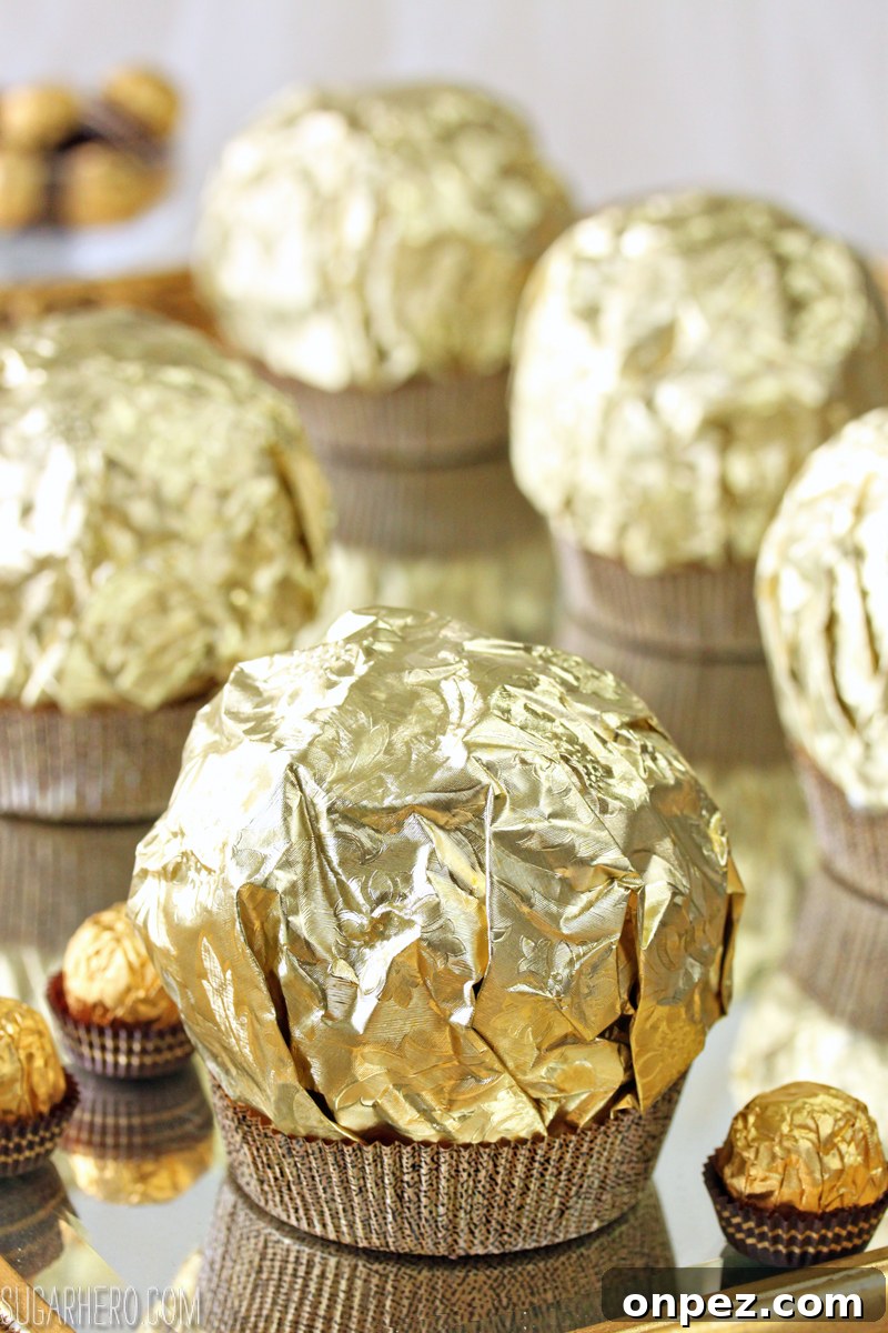 Giant Ferrero Rocher Hazelnut Mousse Cakes - full of chocolate cake and hazelnut mousse! | From SugarHero.com