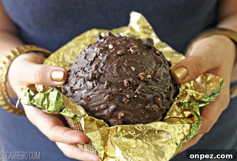 Giant Ferrero Rocher Hazelnut Mousse Cakes - full of chocolate cake and hazelnut mousse! | From SugarHero.com