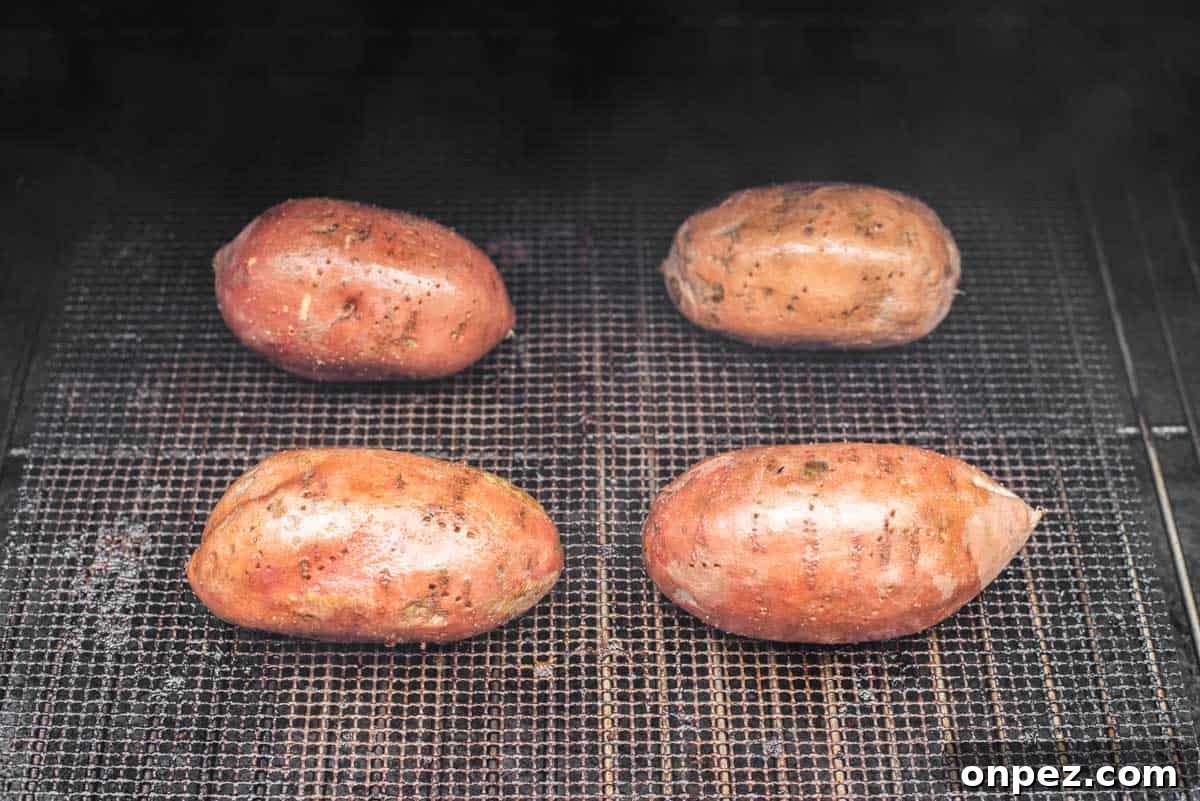 4 sweet potatoes in smoker.