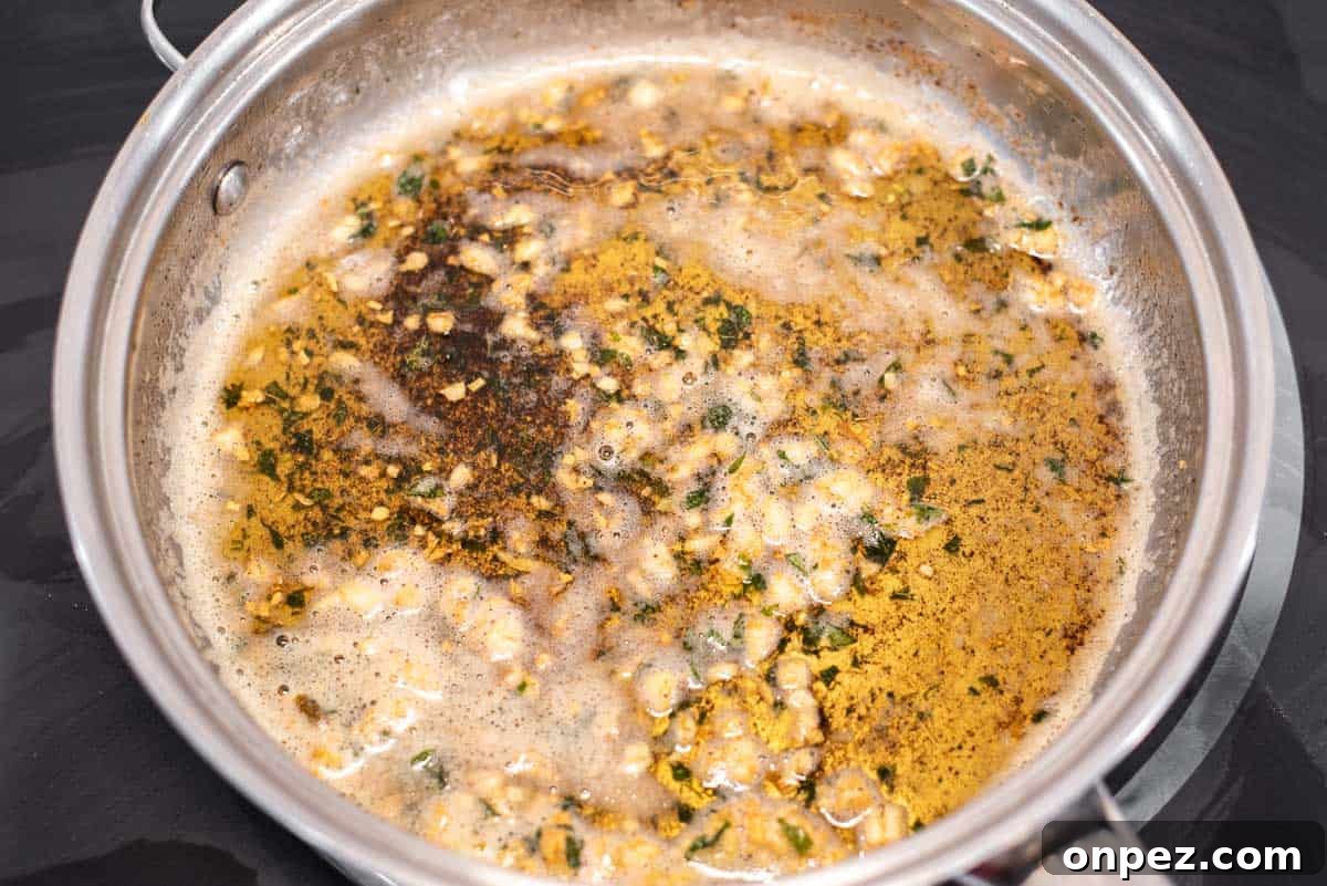 Browned butter in skillet with garlic and sage.