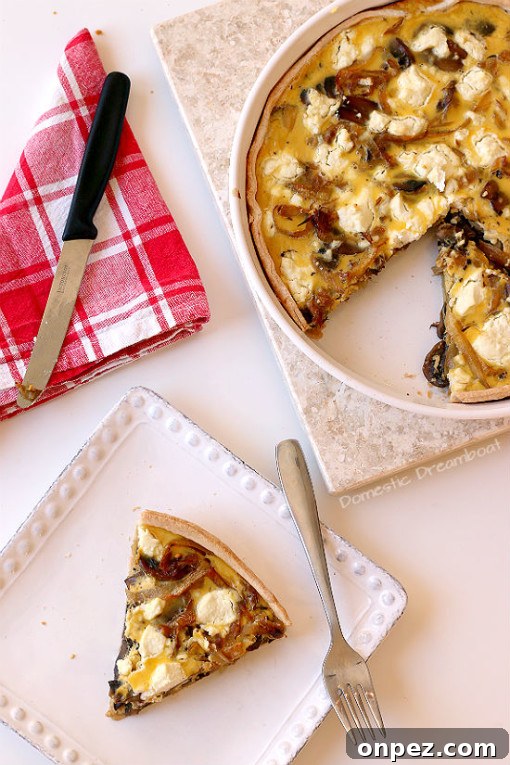 Overhead photo of Caramelized Onion and Sauteed Mushroom Quiche on a white plate.