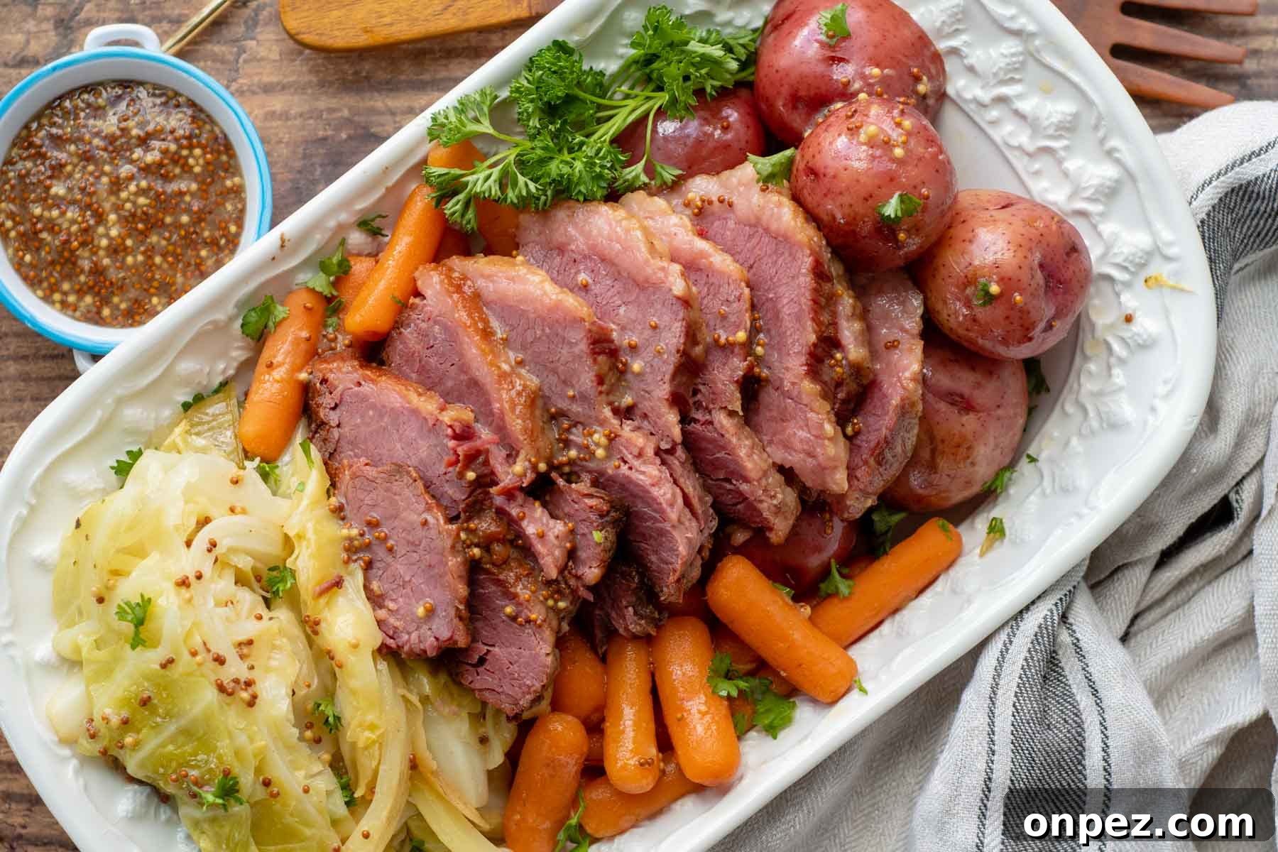 Brown Sugar Corned Beef and Cabbage with Apple Juice 5 overhead shot of corned beef, cabbage, potatoes, carrots on a serving platter