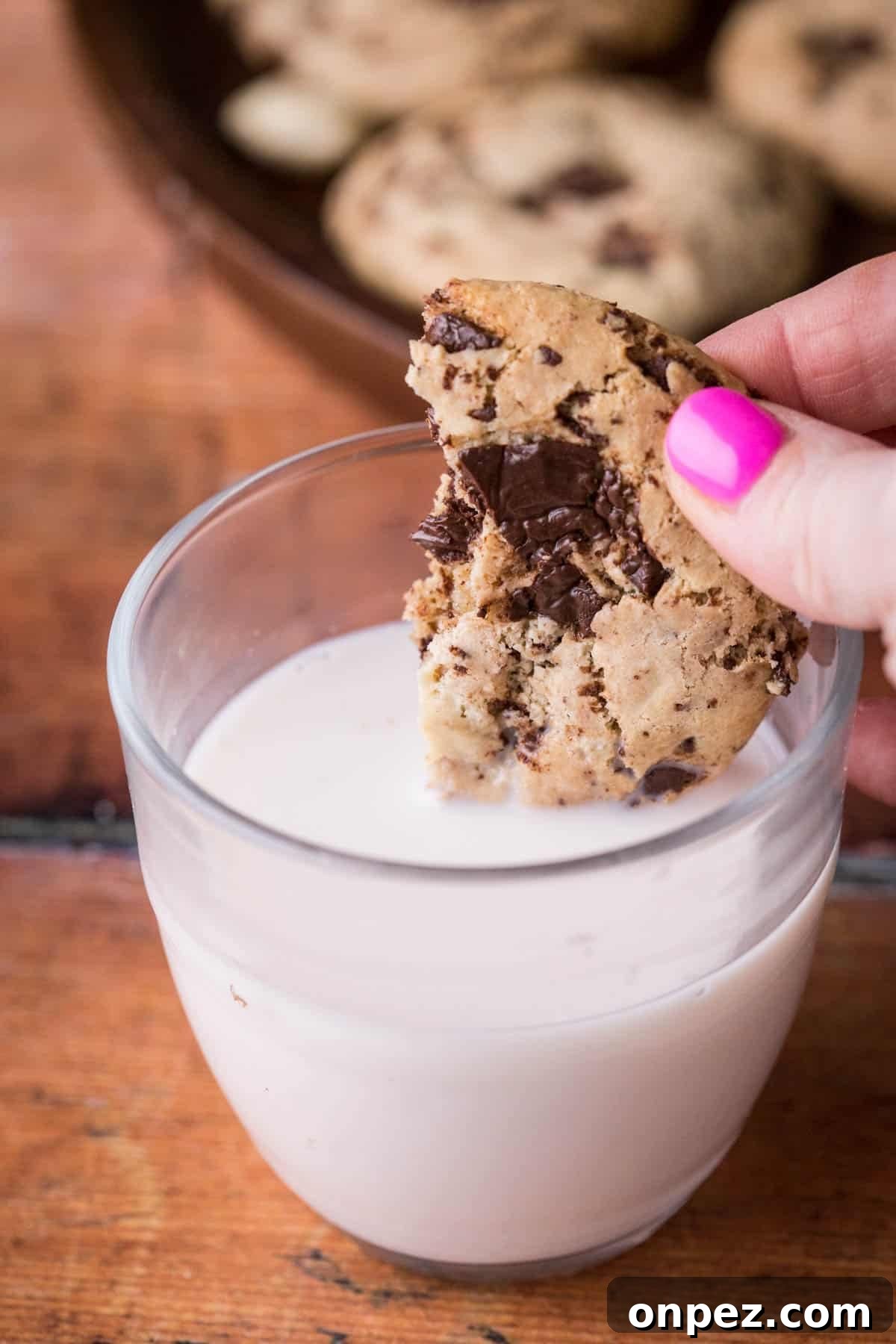 Cashew Butter Cookie dipped into glass of milk.
