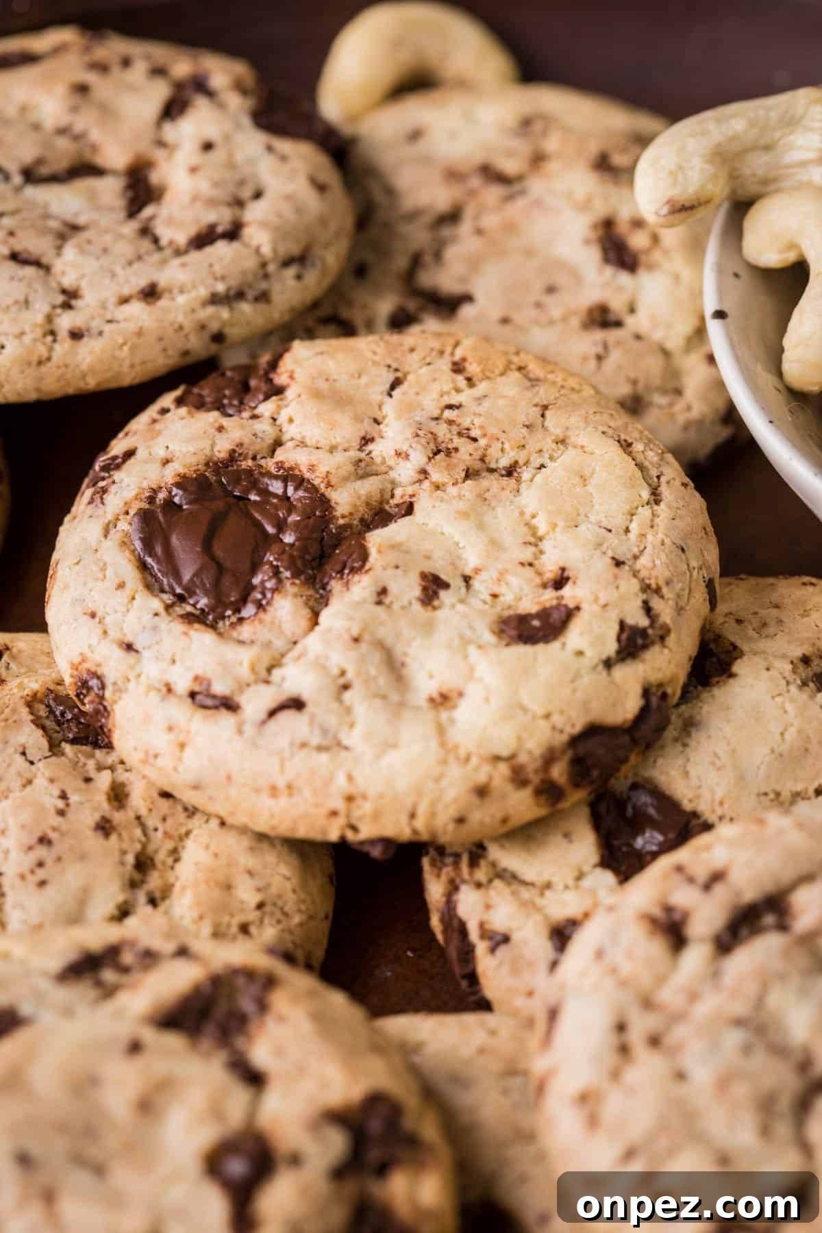 A Cashew Butter Cookie with molten chocolate puddles.