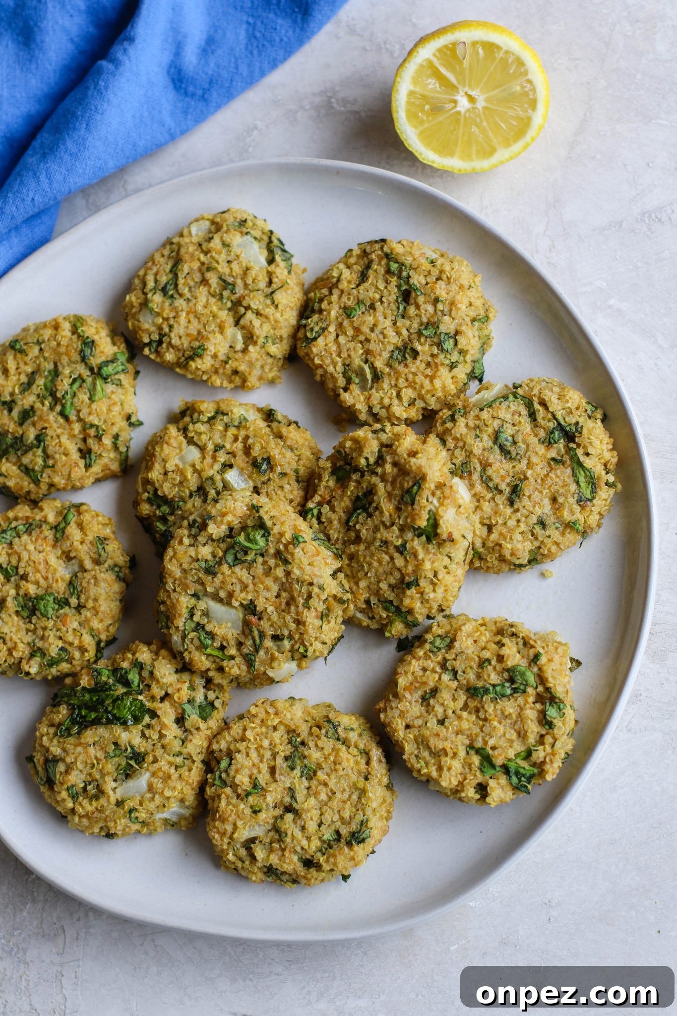 Quinoa Cakes with Basil Pesto served on plate by Flora & Vino