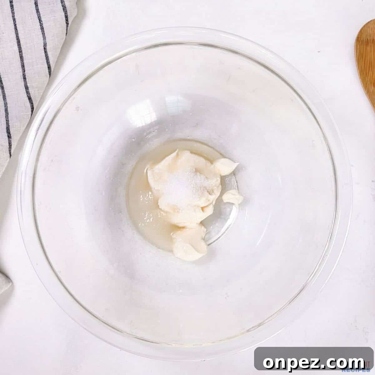 dressing ingredients in glass mixing bowl.