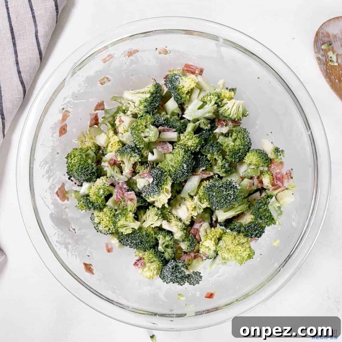 broccoli salad mixed in bowl.