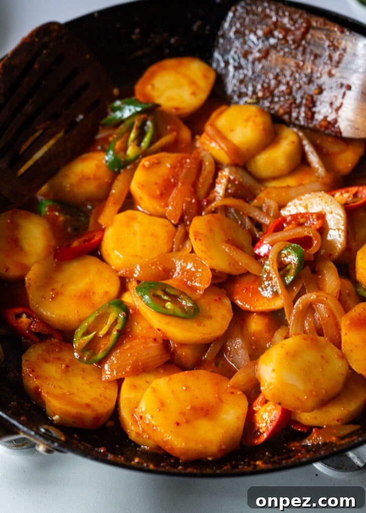 Fresh chilies added to make spicy potato side dish.